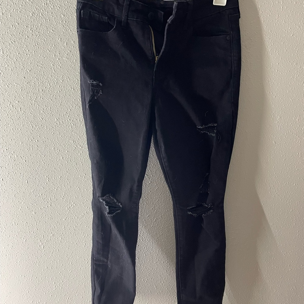 of navy high rise skinny jeans